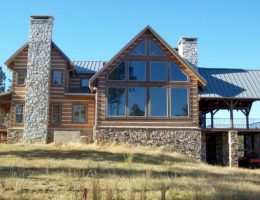 Today's homes use more glass than ever before. beautiful mountain home with lots of glass