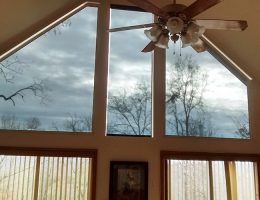 The "after" photo after installing Removable Solar Inserts, plus a functioning solar shade in the middle. Wow! Best Solar Control solar inserts and solar shade after photo
